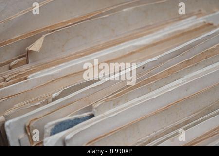 Old files stacked together in a messy archive Stock Photo
