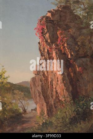 A rock formation beside sunlit river water with rough texture, natural ...