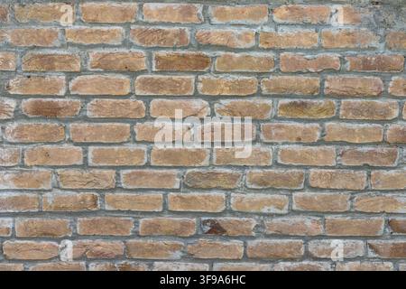 Traditional Brick Wall Background With Aged Bricks and Smooth Mortar Stock Photo