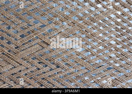 Brown Twisted Rope Mesh With Repeating Woven Texture and Natural Fiber Detail Stock Photo