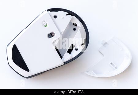 The underside of a wireless computer mouse with its cover removed Stock Photo