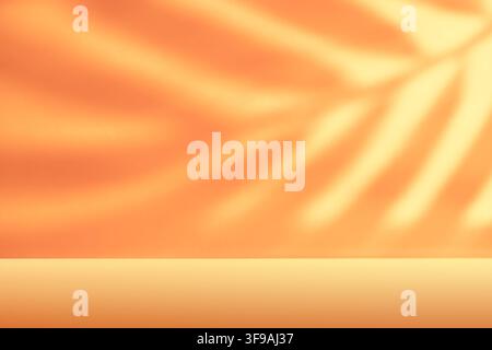 Soft flowing shadows on orange background with empty tabletop for autumn Halloween product mockup or seasonal advertising Stock Photo
