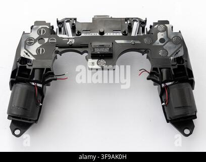 This image shows the disassembled internal parts of a video game controller Stock Photo