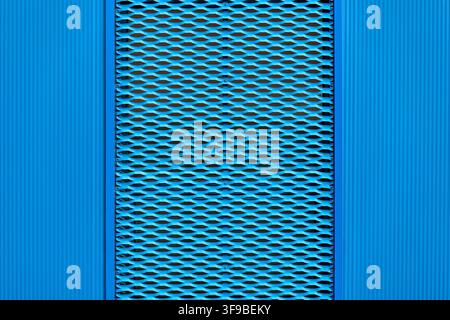 Full-frame texture of a blue expanded metal mesh panel with symmetrical diamond pattern Stock Photo