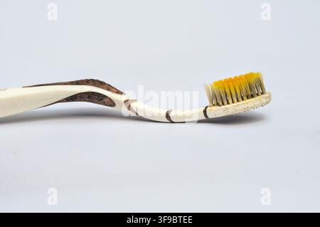 Old Worn Toothbrush on White Background Stock Photo