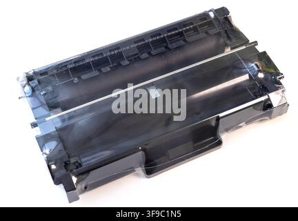 A new black printer toner cartridge is sealed in clear plastic wrap Stock Photo