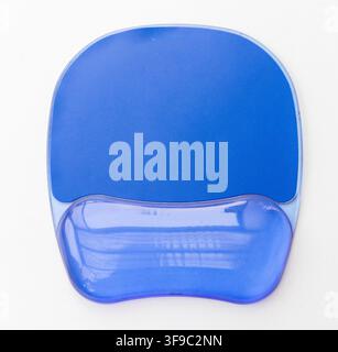 This image shows an ergonomic blue mouse pad with a gel wrist rest Stock Photo