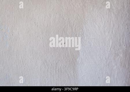 Textured white wall surface with subtle variations and imperfections, suitable for backgrounds or design elements in various projects Stock Photo