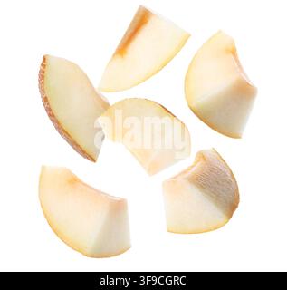 Sweet melon pieces flying in air on white background Stock Photo
