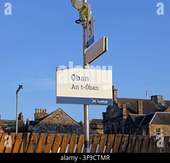 Bilingual Oban railway station sign in English and Gaelic, Scotland, UK. Stock Photo