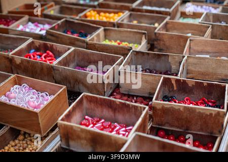 Beads and buttons in wooden crates Stock Photo