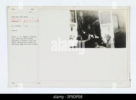 Captain A. E. Dennis, an American Red Cross delegate from Glencoe, Illinois, and his staff serving hot drinks to personnel on an American Army hospital train, during World War I. Stock Photo