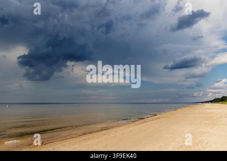 Dramatic dark storm clouds gathering over the sea in Dubulti, Jurmala, Latvia Stock Photo