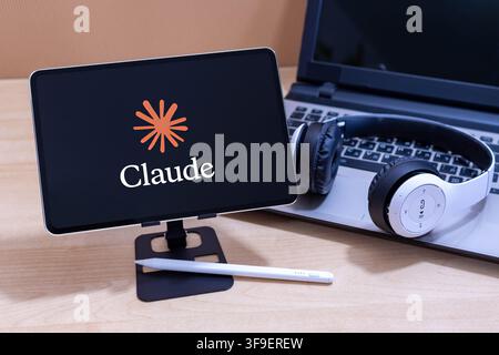 Claude logo on an Apple iPad screen. Stock Photo