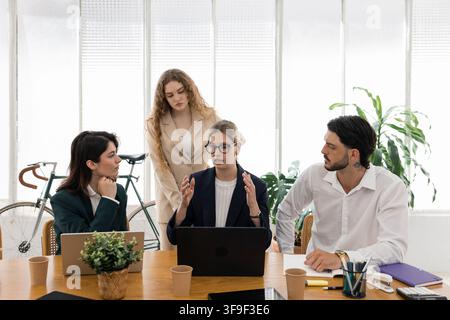 Business people collaborating on creative corporate strategy in office Stock Photo