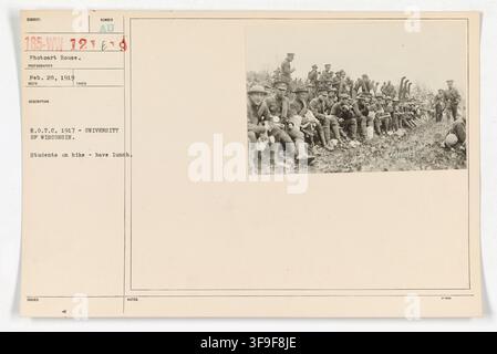 Students of the University of Wisconsin's R.O.T.C. program on a hike, having lunch, in 1917, during World War I. Stock Photo
