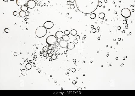 Abstract bubbles in liquid on white background Stock Photo