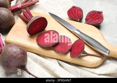 Fresh young beets and knife on table, closeup Stock Photo