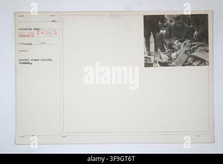A wounded German soldier receiving first aid in the theater of operations, Varennes, during World War I, as, Records of the War Department General and Special Staffs. Stock Photo