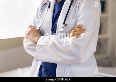 Closeup female nurse or doctor in uniform standing in clinic Stock Photo