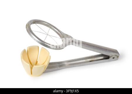 An old egg slicer on a white background. Close-up of kitchen utensils. Stock Photo