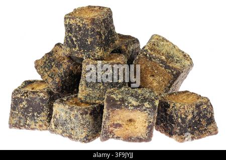 cane sugar jaggery cubes isolated on white background Stock Photo
