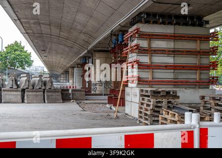 Temporary support structures and heavy concrete blocks are installed underneath the damaged highway bridge in Dresden to prevent a collapse. Stock Photo