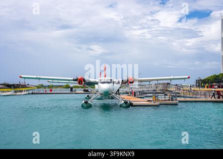 A seaplane docked at a terminal platform in Maldives Stock Photo