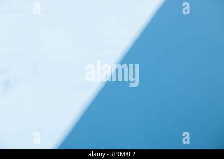 Minimalist abstract geometric background with diagonal shadow overlay on light blue and white surface. Modern clean backdrop template with copy space Stock Photo