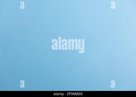 Smooth light blue solid color background texture, clean pastel blue neutral surface backdrop with copy space for product display, advertising presenta Stock Photo