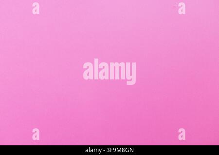 Smooth bright pink solid color background texture, clean vibrant pink surface backdrop with copy space for product display, cosmetics presentation, or Stock Photo