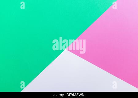 Modern three-color geometric background with green, pink, and white paper sections. Abstract minimalist tricolor backdrop with copy space for banner, Stock Photo