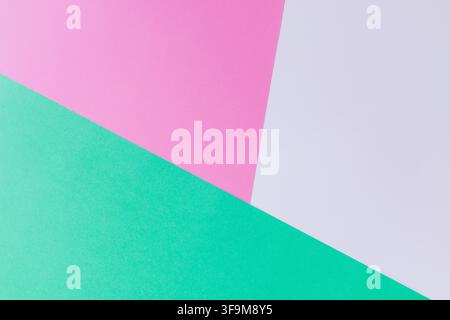 Geometric background featuring mint green, pink, and white paper sections. Abstract minimalist tricolor backdrop with copy space for banner design, br Stock Photo