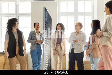 Diverse businesswomen in casual office meeting, discussing strategy and teamwork Stock Photo