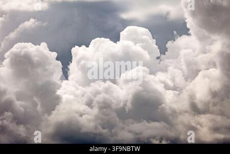 Towering cumulus clouds building across the Dorset sky in dramatic summer weather Stock Photo