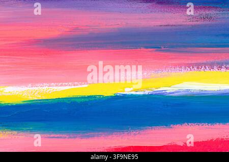 Hand painted abstract artwork with layered horizontal strokes of pink, blue, yellow and green acrylic paint, evoking a sunset horizon over the sea. Stock Photo