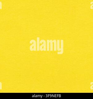 Flat lay of a plain yellow paper surface with fine fibre grain and uniform lighting, offering full copy space for text or product overlays. Stock Photo