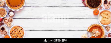 Homemade autumn pie double border. Top view on a white wood banner background with copy space. Assortment of apple, pumpkin and pecan pies. Stock Photo