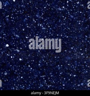 Full frame macro of a deep blue engineered stone slab flecked with white quartz chips, used for countertops, worktops and decorative interior surfaces Stock Photo