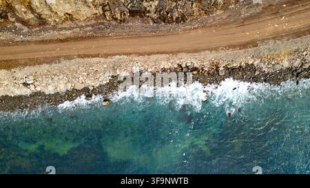 Top view with the edge where ocan and rocky shore meet each other, rural scene outside Sudujeri. Stock Photo