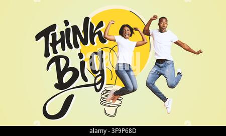 Joyful Young Black Couple Jumping With Excitement Against Yellow Background, Business Concept Stock Photo