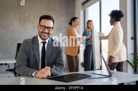 Portrait of successful multicultural business team working in corporate business office Stock Photo
