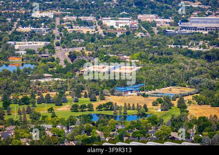 Aerial view of a serene lake with lush green islands and distant hills ...