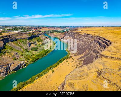 Windy River Spring Aerial view of river winding through green landscape. Clouds loom above ...