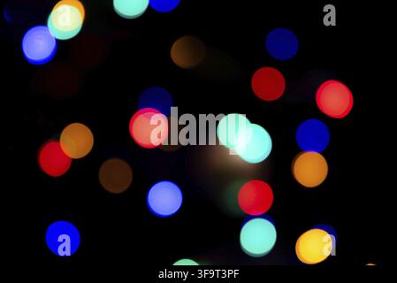 Abstract circular bokeh background of colorful Christmaslights in the dark Stock Photo