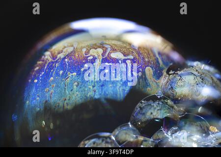 Abstract pattern, multicolored chaotic texture inside of the soap bubble, closeup. High quality FullHD footage Stock Photo