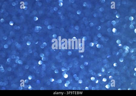 Vibrant Blue Bokeh Background with Shimmering Light Patterns Stock Photo