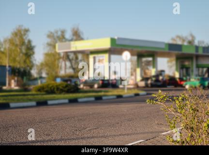 Blurred background of a gas station at night for city and travel abstract background. High quality photo Stock Photo