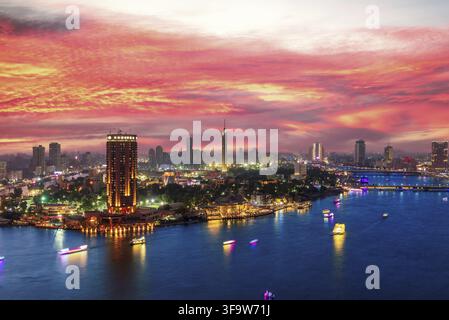 Incredible sunset over the Nile and night center of Cairo, Egypt Stock Photo