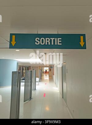 Hospital corridor with exit sign Stock Photo